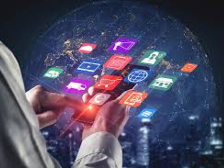 Person holding mobile device and looking at all the applications possible to open.