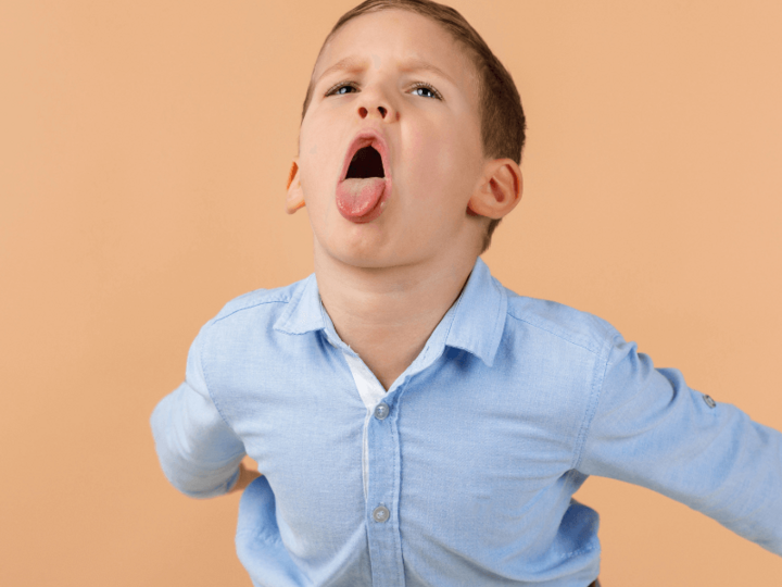 Young boy making a silly facial expression