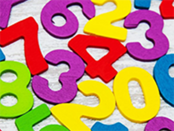 Brightly colored numbers spread out on table