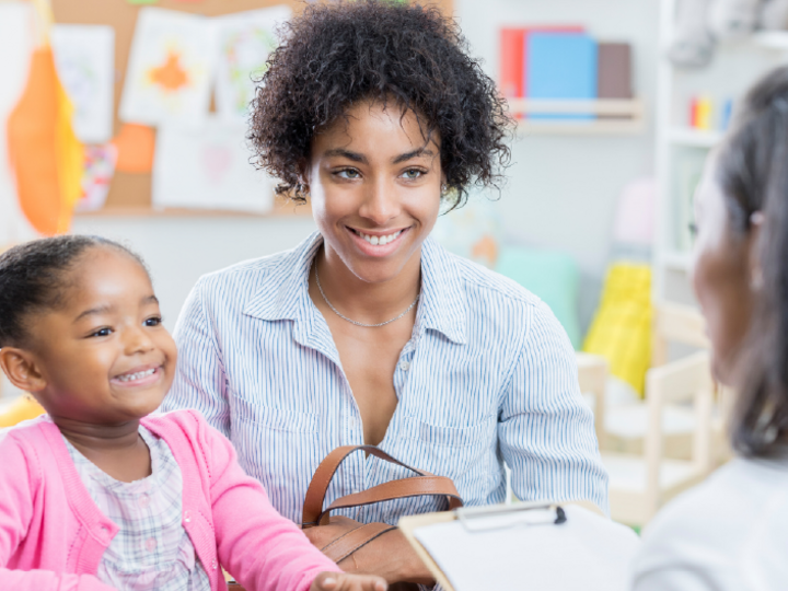 Aduliont femalle with young female with a teacher having a conversat