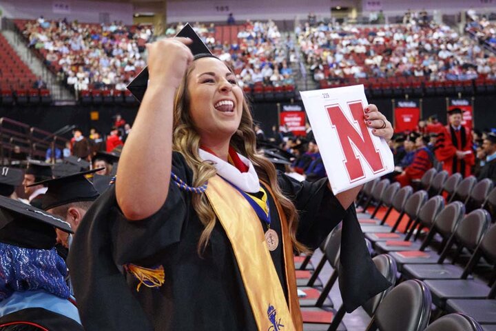 Masters degree student with diploma